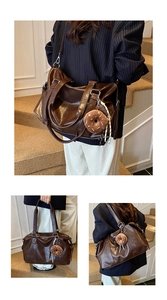 Detail of dark brown tote bag with glossy finish and cute plush donut charm