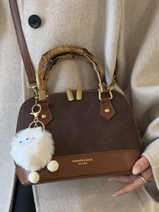 Retro colorblock shell bag with bamboo handle, suede拼接 and white fur ball charm