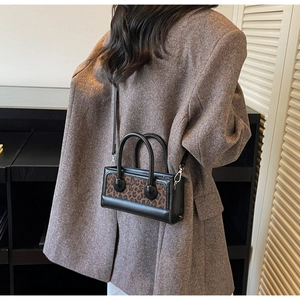 Retro leopard print mini square bag styled with a tweed blazer for a chic autumn look