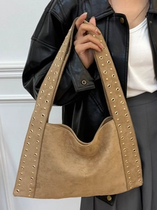 Vintage brown suede hobo bag with gold metal rivets and wide shoulder strap style