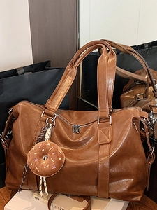 Brown large capacity tote bag with adjustable strap and plush donut keychain decoration
