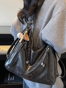 Retro dark brown leather shoulder tote bag with baseball charms and adjustable strap