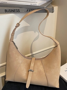 Retro beige suede crescent shoulder bag with adjustable strap and stitching detail