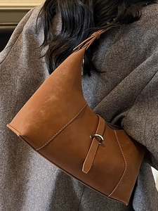 Vintage brown suede crescent shoulder bag with white contrast stitching and metal ring detail