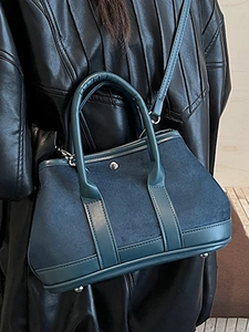 Deep teal textured patchwork handbag with top handles and shoulder strap for women