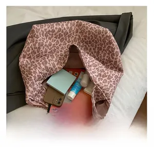 Top view of leopard print tote bag interior showing large capacity for daily essentials