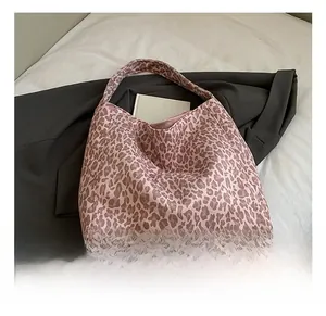 Detail of pink leopard print tote bag in soft velvet fabric for fall style fashion