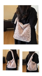 Detail shot of large leopard print faux fur tote bag with soft plush texture on model