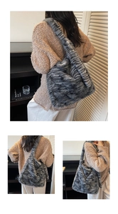 Close-up of grey striped faux fur tote bag showing plush texture and shoulder strap