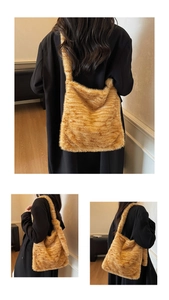 Detail view of large faux fur tote bag with brown tiger stripes and soft texture