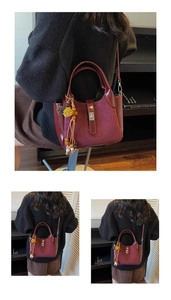 Detail of burgundy bucket bag featuring textured patchwork and ethnic tassel charm