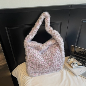 Close-up of pink and grey leopard print faux fur tote bag showing soft plush texture