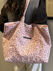 Vintage leopard print tote bag with large capacity for women shown on shoulder