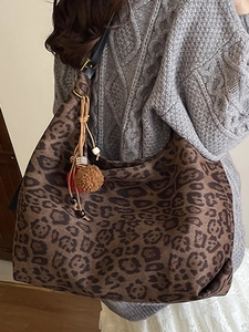 Leopard print tote bag for women with tassel charm and adjustable black strap