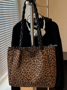 Leopard print tote bag with woven handles and spacious interior for autumn style