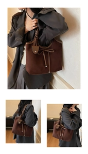 Close-up of vintage brown suede tote with knotted handle and silver metal accents