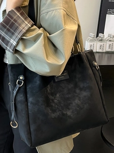 Fashionable black oversized tote bag in faux suede with vintage gold hardware for women