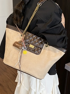 Large beige frosted tote bag with brown leather trim and golden chain strap for women