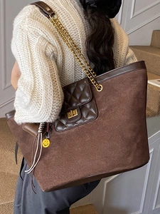 Brown suede tote bag with quilted front pocket and gold chain strap for women