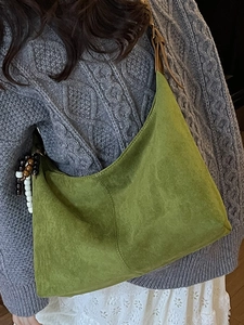 Vintage olive green suede tote bag with brown leather strap and colorful bead charm