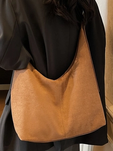 Minimalist tan suede hobo tote bag with large capacity and decorative stitching