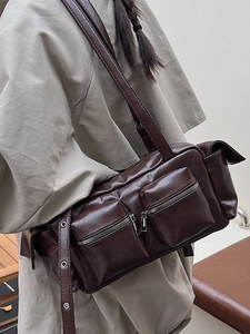 Chic dark chocolate leather shoulder bag with silver multi-pocket details and zippers