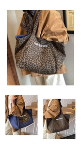 Detail showing the reversible leopard print and denim canvas tote bag with large capacity