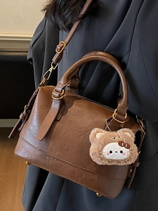 Vintage brown PU leather Boston bag with a cute bear charm for elegant women's daily commute