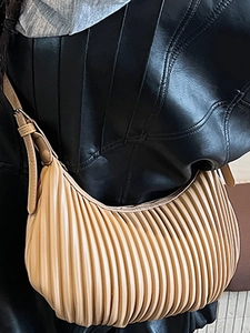 Beige pleated crescent hobo bag for women with adjustable strap and textured finish