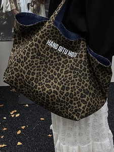 Large capacity leopard print canvas tote bag with artistic lettering for stylish commuting
