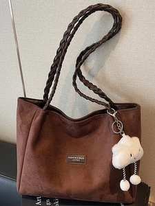 Large dark brown suede tote bag with woven handles and a white plush charm for women