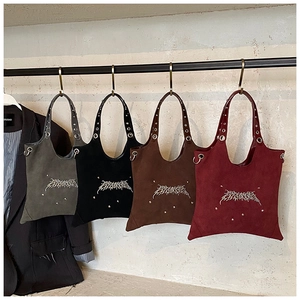 Four suede tote bags in grey black brown and burgundy with gothic embroidery and studs
