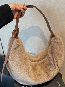 Chic beige faux fur hobo bag with adjustable brown leather strap for autumn fashion