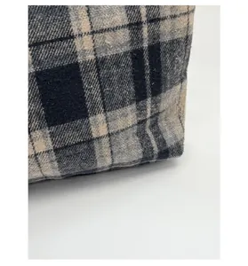 Close-up of vintage mixed-color woven plaid fabric with high-quality textured finish