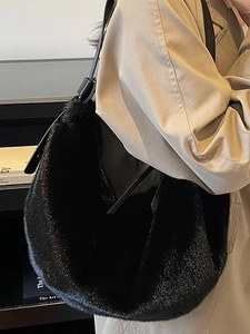 Chic black faux fur hobo shoulder bag with leather strap for elegant winter styling