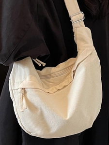 Minimalist cream canvas crossbody bag with adjustable wide strap for women daily use