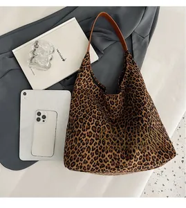 Large leopard print tote bag with items showing spacious capacity for daily commute
