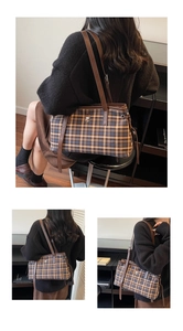 Detail view of retro plaid tote bag with brown leather straps and cute bear embroidery