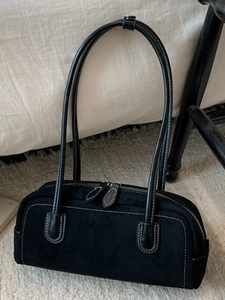Vintage black suede baguette bag with white contrast stitching and long shoulder strap