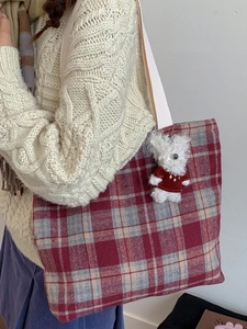 Vintage red plaid woven tote bag with a white shoulder strap and dog charm detail