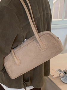 Retro beige suede baguette bag for women, minimalist shoulder bag style with long straps