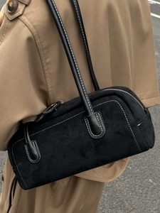 Retro black suede baguette bag with white contrast stitching for autumn 2025 fashion style