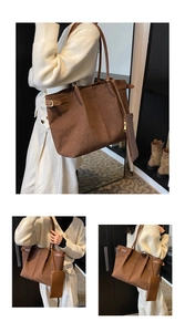 Detail of a large brown suede tote bag with adjustable shoulder straps and matching pouch