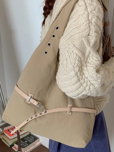 Minimalist khaki tote bag with wide eyelet strap and metallic buckle for women