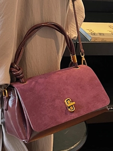 Elegant burgundy small square crossbody bag with suede flap and gold twist lock detail