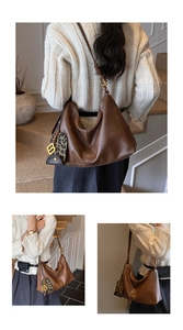 Detail of a brown tote bag with leopard print charm and golden B pendant on a soft strap