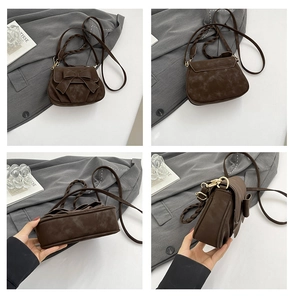 Détails du sac selle marron foncé avec nœud papillon, poignée tressée et texture mate
