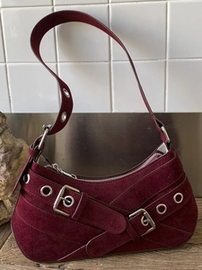 Vintage burgundy suede underarm bag with silver buckles and Y2K aesthetic design