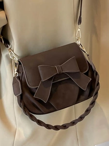 Sac bandoulière carré vintage marron foncé avec un grand nœud décoratif et lanière