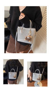 Detail of grey leopard print tote bag featuring a plush monster charm and long strap